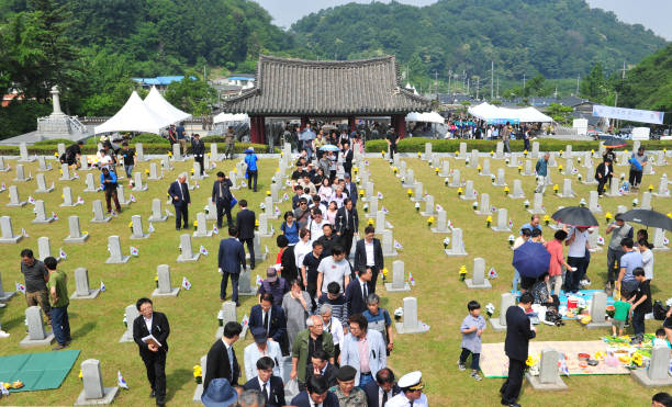 On June 6, 2018, on the 63rd Korean Memorial Day, visitors to Jeonju military and police cemetery in Jeonju, South Korea. On June 6, 2018, on the 63rd Korean Memorial Day, visitors to Jeonju military and police cemetery in Jeonju, South Korea. day 6 stock pictures, royalty-free photos & images