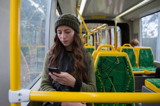 トラムの若い女性のテキスト メッセージ - transportation public transportation melbourne victoria state ストックフォトと画像