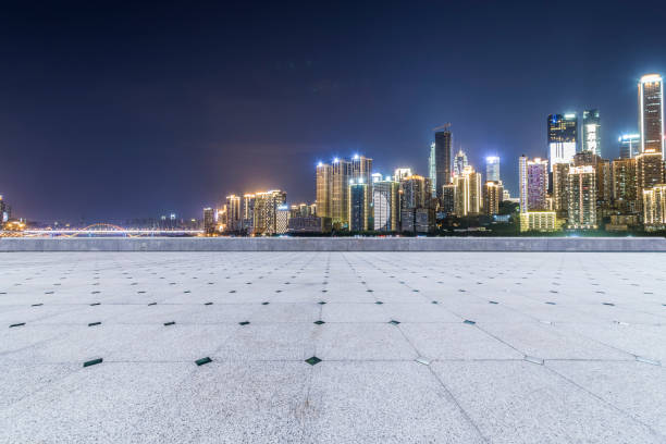 istock Panoramic skyline and modern business office buildings with empty road,empty concrete square floor 969964268