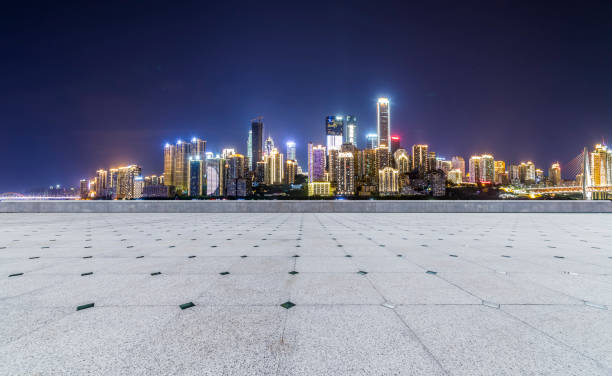 istock Panoramic skyline and modern business office buildings with empty road,empty concrete square floor 969964618