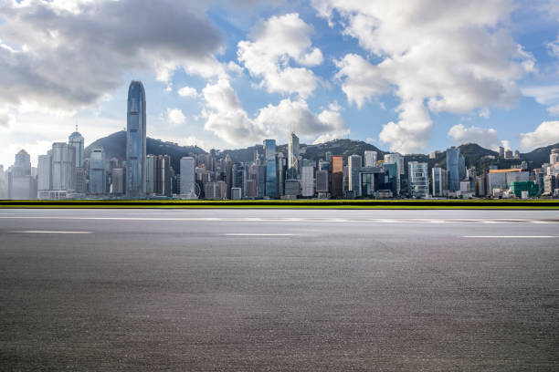 istock Panoramic skyline and modern business office buildings with empty road,empty concrete square floor 969967318