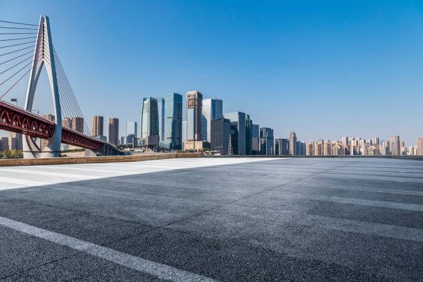 istock Panoramic skyline and modern business office buildings with empty road,empty concrete square floor 969967408