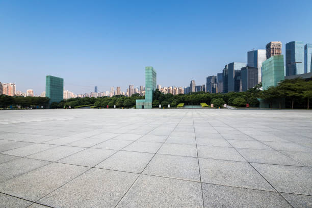 istock Panoramic skyline and modern business office buildings with empty road,empty concrete square floor 969969716
