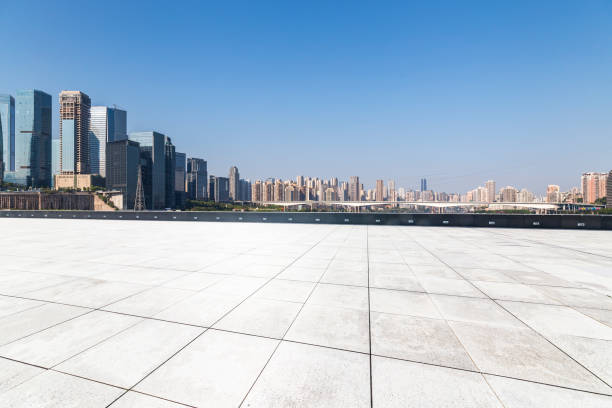 istock Panoramic skyline and modern business office buildings with empty road,empty concrete square floor 969969838