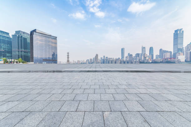 istock Panoramic skyline and modern business office buildings with empty road,empty concrete square floor 969973568