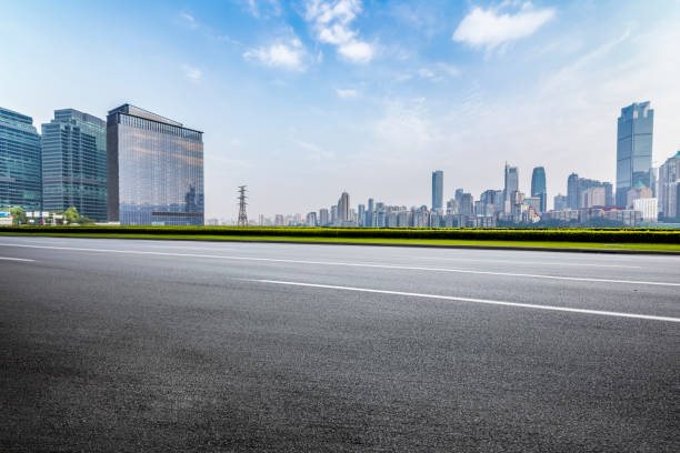 istock Panoramic skyline and modern business office buildings with empty road,empty concrete square floor 969975176