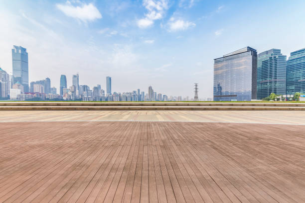 istock Panoramic skyline and modern business office buildings with empty road,empty concrete square floor 969975732