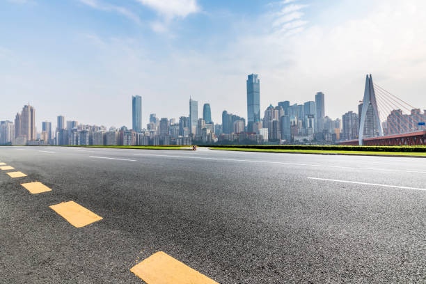 istock Panoramic skyline and modern business office buildings with empty road,empty concrete square floor 969975764