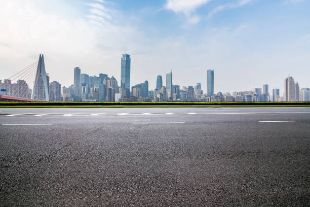 istock Panoramic skyline and modern business office buildings with empty road,empty concrete square floor 969975782