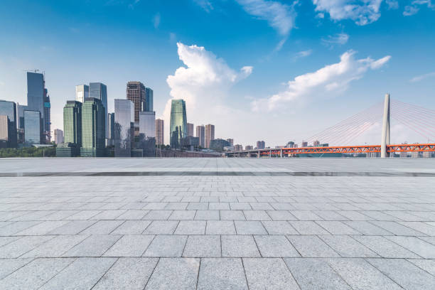 istock Panoramic skyline and modern business office buildings with empty road,empty concrete square floor 969976074