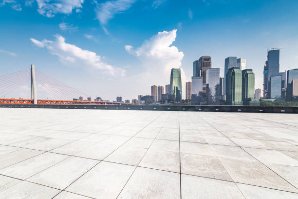 istock Panoramic skyline and modern business office buildings with empty road,empty concrete square floor 969976148