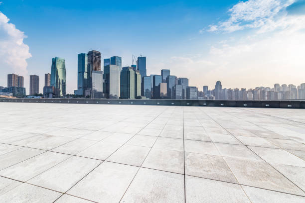 istock Panoramic skyline and modern business office buildings with empty road,empty concrete square floor 969976332