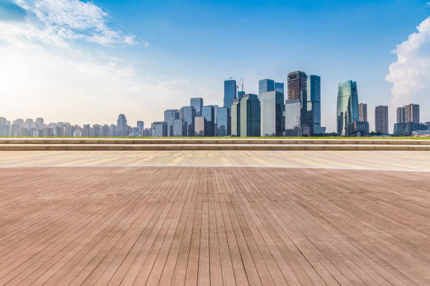 istock Panoramic skyline and modern business office buildings with empty road,empty concrete square floor 969976334