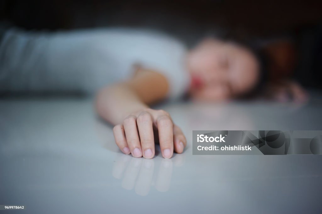 concept the women fall down on the floor close up at the hand Women Stock Photo