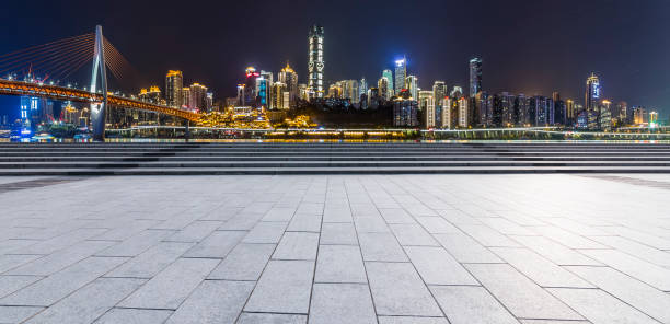 istock Panoramic skyline and modern business office buildings with empty road,empty concrete square floor 969978972
