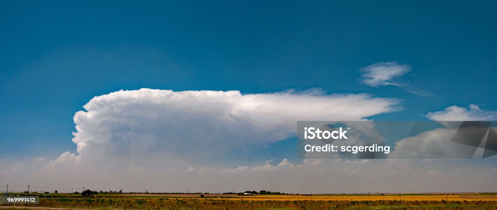 Cloud Panorama Near Garden City Kansas Thunderhead builds out over the Great Plains near Garden City, Kansas Kansas Stock Photo