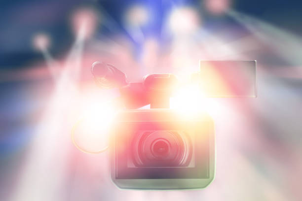 istock professional video camcorder in studio with blurred lights on stage background 969991776