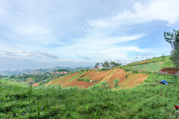 istock Hillside Deforestation for Agricultural Site with Downtown Bandung in the Faraway Background, West Java, Indonesia 969993992