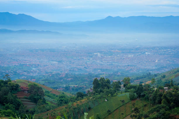 istock Misty Downtown Bandung in the Faraway Background 969994314