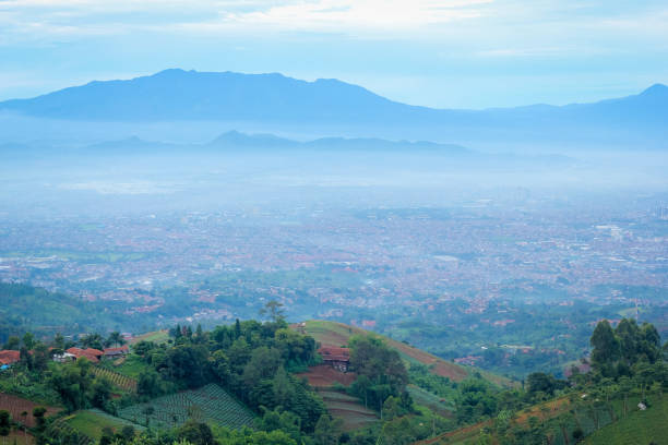 istock Misty Downtown Bandung in the Faraway Background 969994322