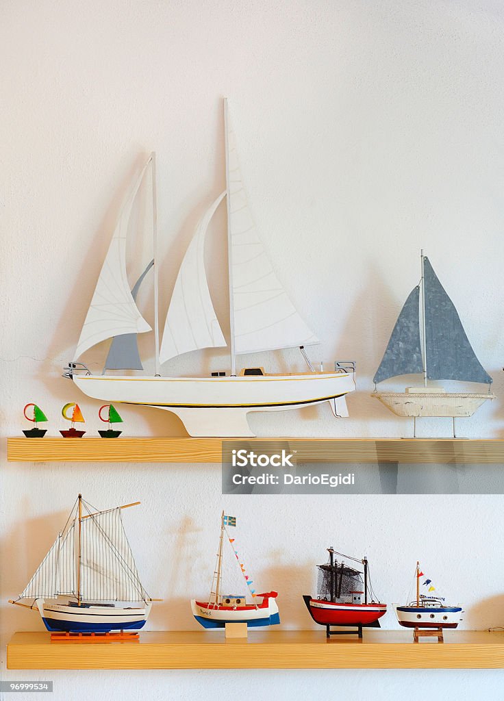 Selection of different wooden little boats in a seaside house  Model - Object Stock Photo