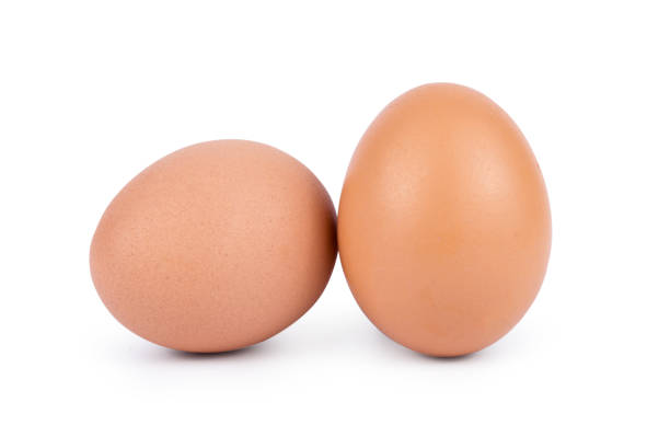 istock Two brown eggs isolated on white background cutout 970007418