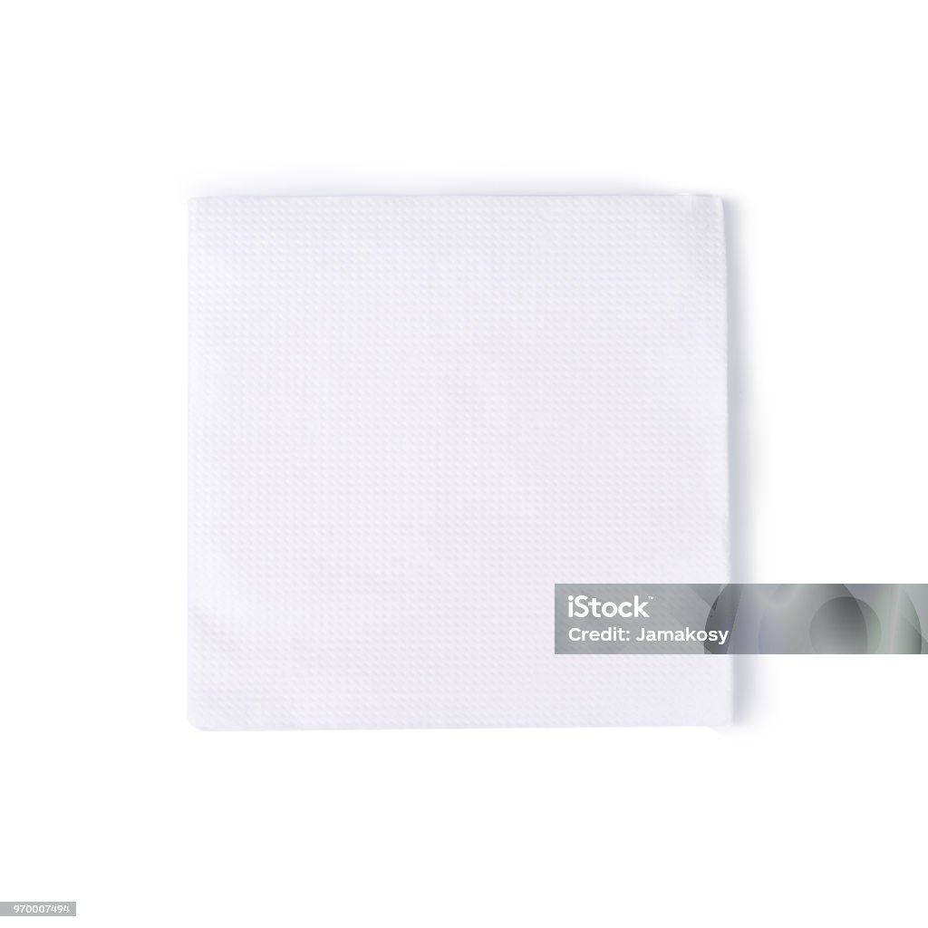 Group of white closeup square papper napkins isolated on white background Group of white square papper napkins isolated on white background Napkin Stock Photo