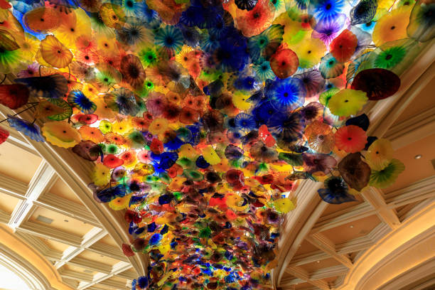 Colorful Fiori di Como glass flower structure by sculptor Chihuly in the lobby of the Bellagio hotel and casino on the Las Vegas strip Las Vegas, Nevada - May 27, 2018 : Colorful Fiori di Como glass flower structure by sculptor Chihuly in the lobby of the Bellagio hotel and casino on the Las Vegas strip. bellagio ceiling stock pictures, royalty-free photos & images