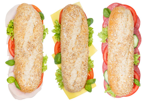 sub-sandwiches vollkorn getreide baguettes mit schinken salami käse - sandwich submarine sandwich ham bun stock-fotos und bilder