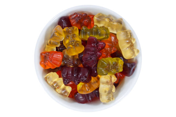 istock Gummy bears sweets from above bowl isolated on white 970021196