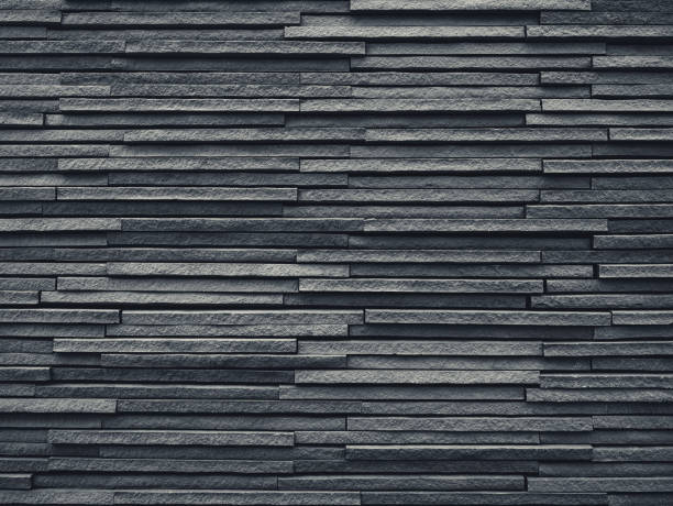 istock Black Tiles slate wall pattern Architecture details Background 970021474