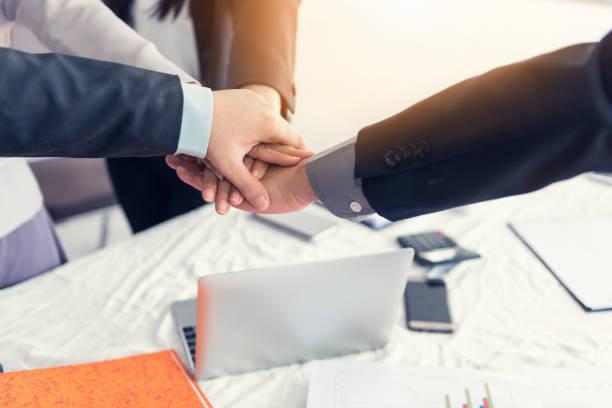 istock Business teamwork joining hands together after meeting their project, Unity and teamwork concept 970028852