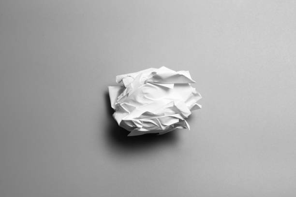 white lump of paper on gray background. ball of paper - napkin black blank ideas imagens e fotografias de stock