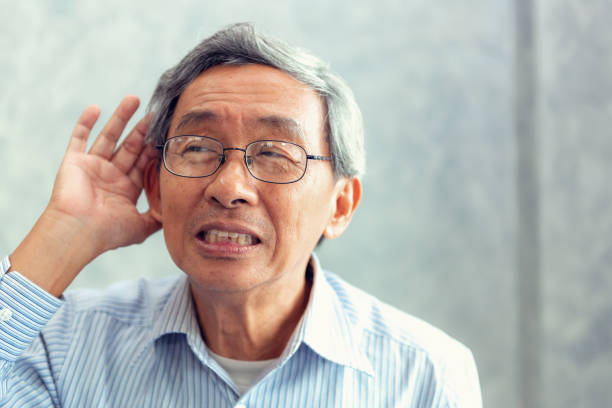Portrait of senior man to trying hear something sound around him Portrait of senior man to trying hear something sound around him. old man cupping his ear to hear something stock pictures, royalty-free photos & images