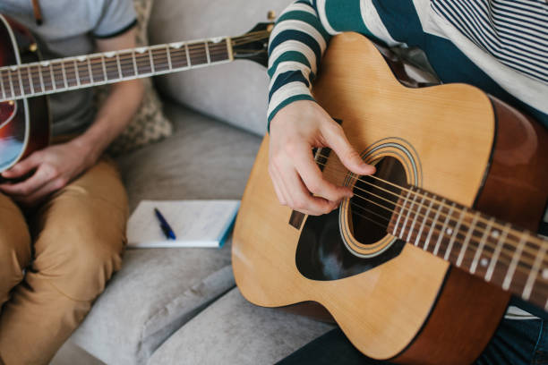 istock Learning to play the guitar. Music education. 970034762