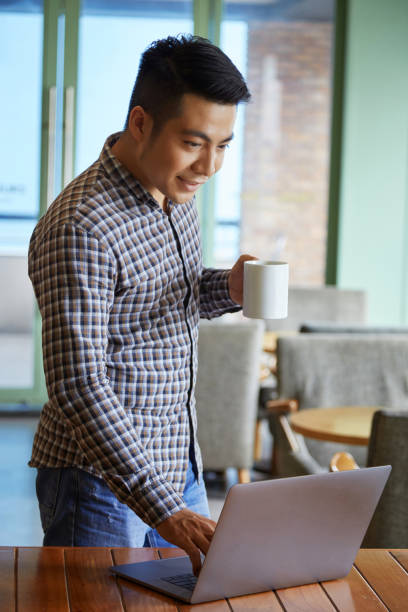 istock Connecting his laptop to internet 970039184
