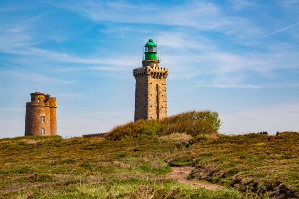 Footpath Leading to the Lighthouse Footpath leading to the lighthouse from Cap de Frehel on Armor Coastline in Brittany in North of France. frehal photos stock pictures, royalty-free photos & images