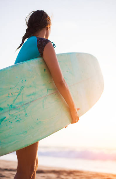 istock young surfer woman 970061002