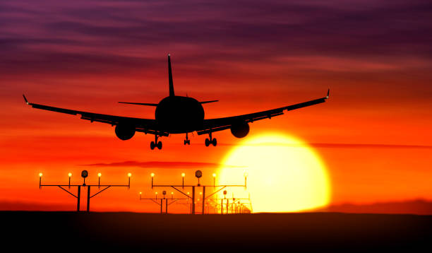 istock Jet airplane silhouette landing on sunset 970061418