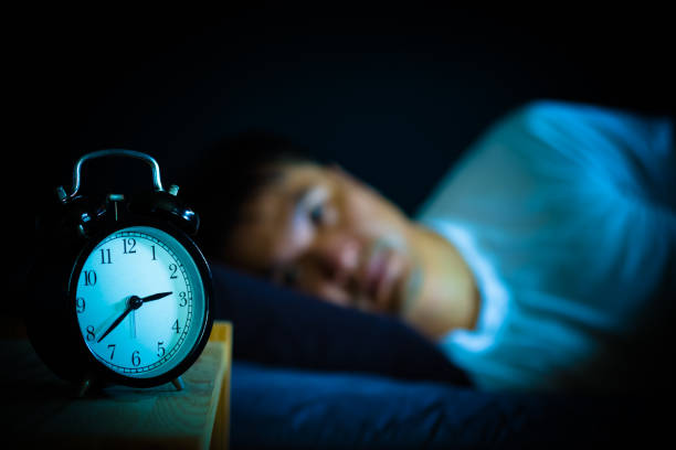 istock asian man in bed suffering insomnia and sleep disorder thinking about his problem at night 970067204