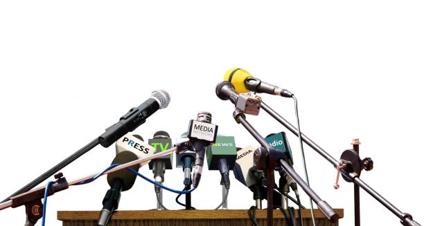 Press conference microphones on white background Press conference microphones standing on white background press room stock pictures, royalty-free photos & images
