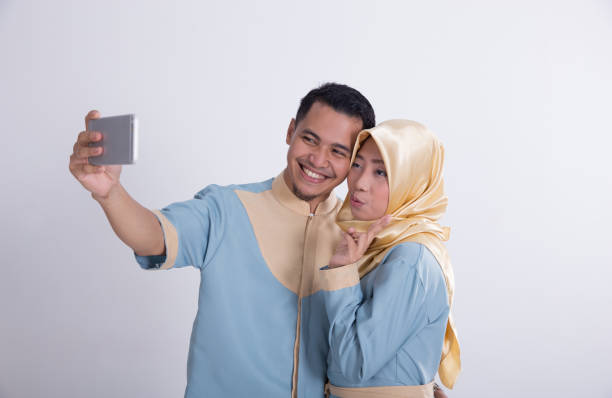 istock muslim couple taking selfie 970072466