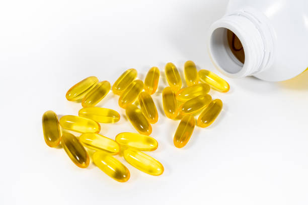 istock evening primrose oil on white isolated background. 970074192