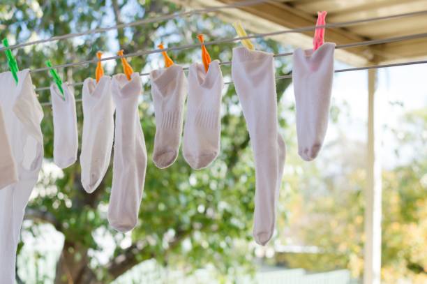 Socks hanging on a washing line stock photo