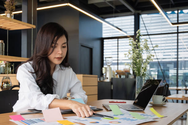 istock business people post it notes idea discussing and planning in office table, business concept 970077584