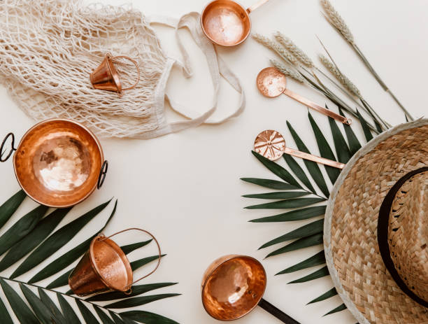 istock Minimal summer concept. Hipster hat with tropical leaves on pastel background. Flat lay 970085954