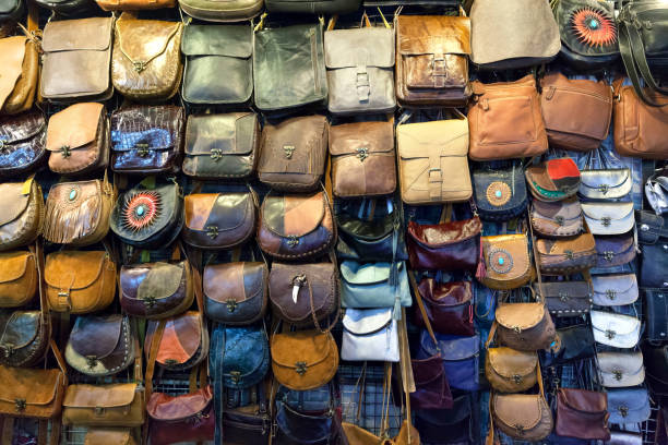 Many purses and accessories in a souvenir shop.
