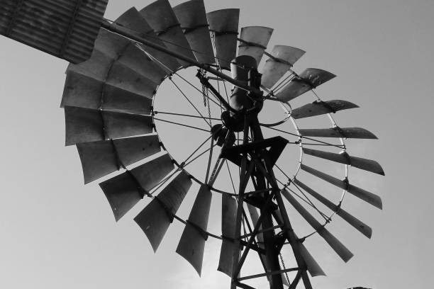 The top of a white windmill and lighthouse on a white background.