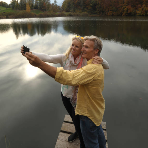 istock Couple take selfie at lakeside 970091610