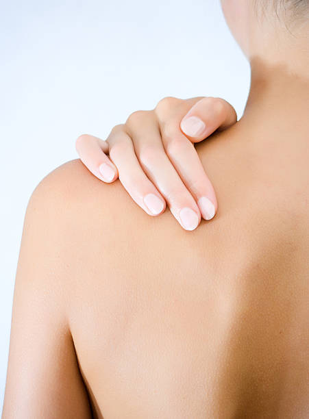 istock Female right hand clutching left shoulder 97009320